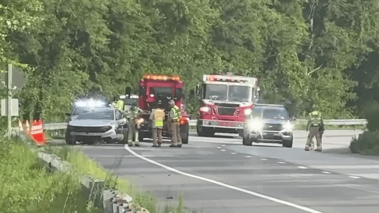 Guardrail along a highway near wooded roadside after a single-vehicle crash