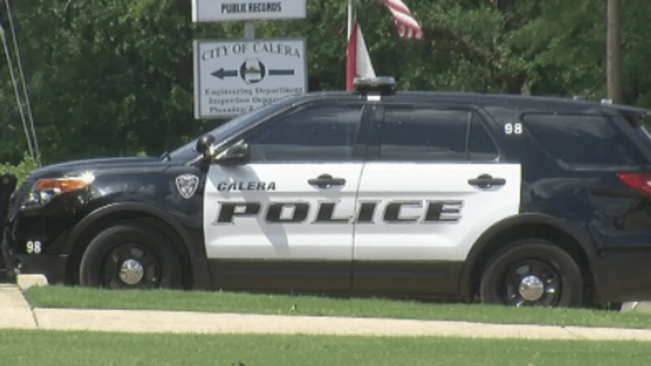Calera police vehicle parked after an arrest tied to a tag reader alert and a separate traffic stop